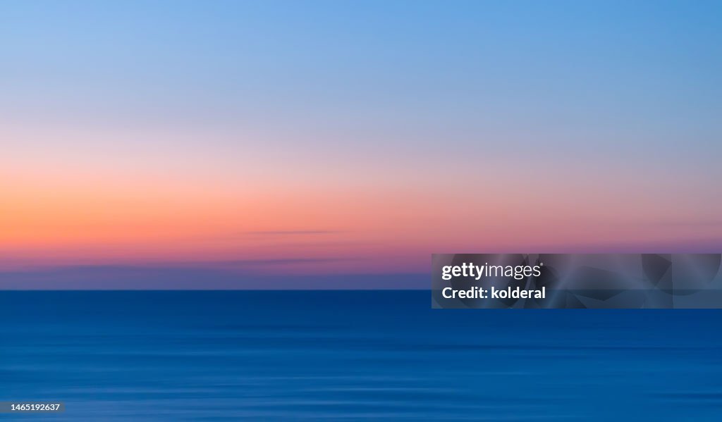 Vivid colors of Mediterranean sunset, panning technique