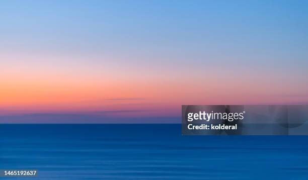 vivid colors of mediterranean sunset, panning technique - sunset stock pictures, royalty-free photos & images
