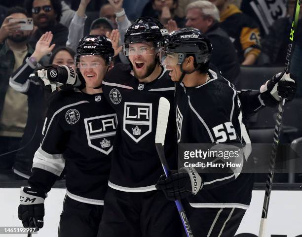 Adrian Kempe of the Los Angeles Kings celebrates his second goal of the game with Mikey Anderson and Quinton Byfield, to take a 4-0 lead over the...