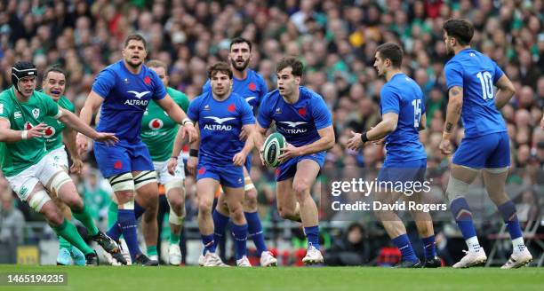 Damian Penaud of France runs with the ball during the Six Nations Rugby match between Ireland and France at the Aviva Stadium on February 11, 2023 in...