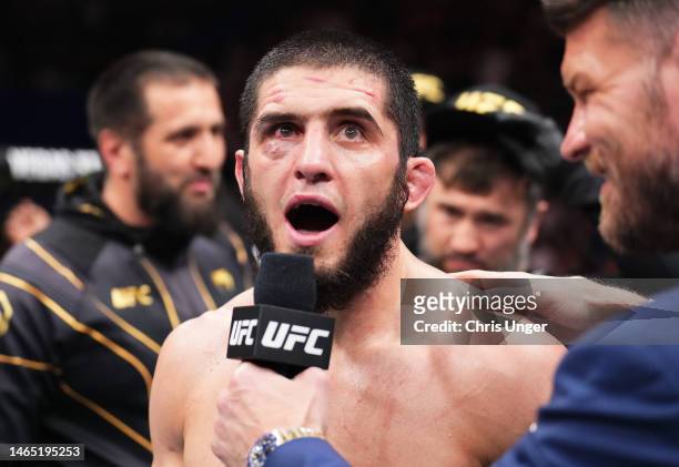 Islam Makhachev of Russia reacts after his victory over Alexander Volkanovski of Australia in the UFC lightweight championship fight during the UFC...