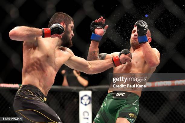 Islam Makhachev of Russia lands a punch against Alex Volkanovski of Australia in the UFC lightweight championship fight during UFC 284 at RAC Arena...