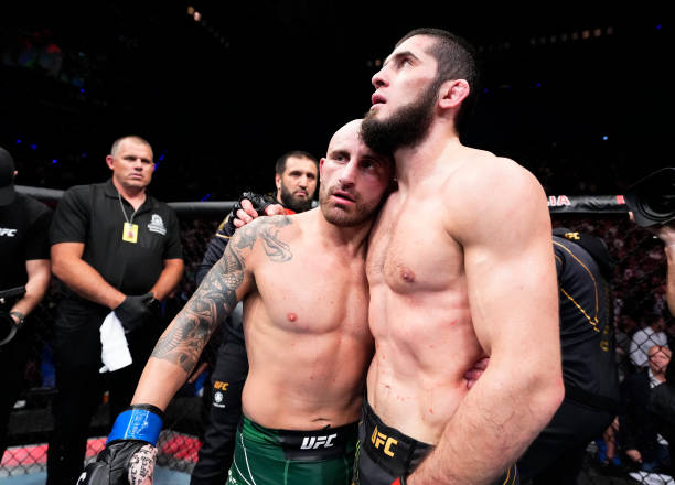 Islam Makhachev of Russia and Alexander Volkanovski of Australia talk after their UFC lightweight championship fight during the UFC 284 event at RAC...