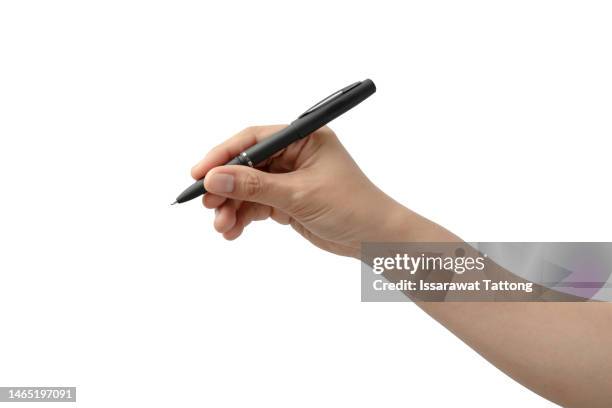 young woman holding pen on white background, closeup - handgebaar stockfoto's en -beelden