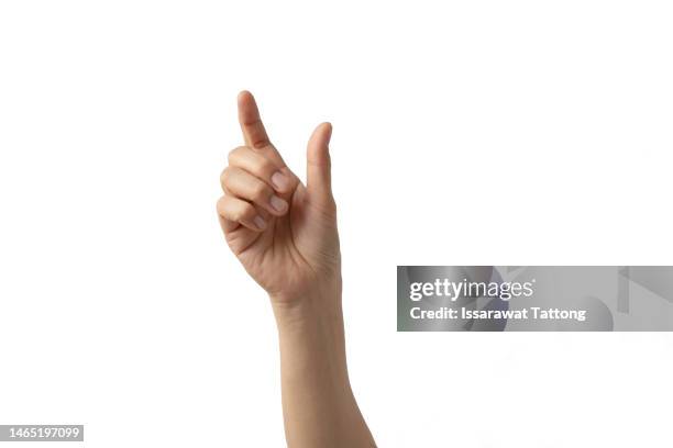 hand holding something isolated on white background - dito umano foto e immagini stock
