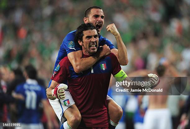 Leonardo Bonucci and Gianluigi Buffon of Italy celebrate victory and progress to the quarter finals during the UEFA EURO 2012 group C match between...