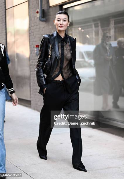 Amalie Gassmann is seen wearing a black leather jacket, sheer top and black pants outside the Proenza Schouler show during New York Fashion Week F/W...