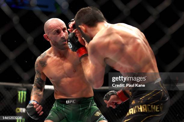 Alex Volkanovski of Australia battles Islam Makhachev of Russia in the UFC lightweight championship fight during UFC 284 at RAC Arena on February 12,...