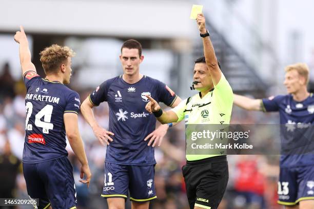 Oskar Van Hattum of the Phoenix is shown a yellow card by the referee Alireza Faghani during the round 16 A-League Men's match between Macarthur FC...