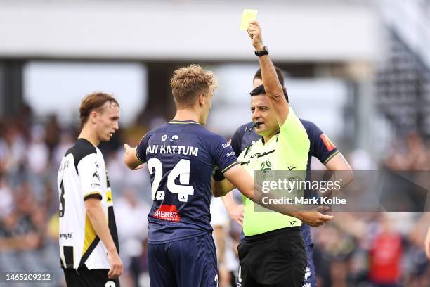 Oskar Van Hattum of the Phoenix is shown a yellow card by the referee Alireza Faghani during the round 16 A-League Men's match between Macarthur FC...