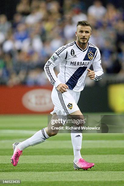 David Beckham of the Los Angeles Galaxy runs during the MLS match against the Montreal Impact at the Olympic Stadium on May 12, 2012 in Montreal,...