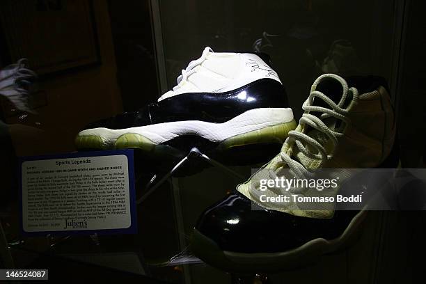 Pair of Air Jordan XI concord shoes worn and signed by Michael Jordan are displayed at the Julien's Auctions press call for Music Icons And Sports...