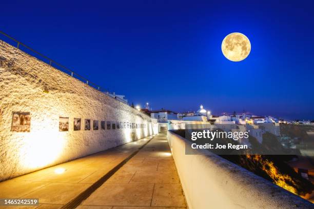 full moon, albufeira, portugal - albufeira stock pictures, royalty-free photos & images