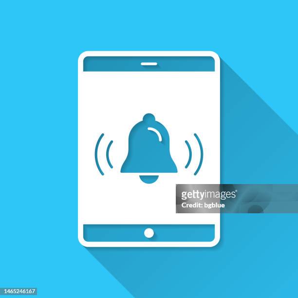 tablet pc with ringing bell - notification. icon on blue background - flat design with long shadow - notification bell stock illustrations