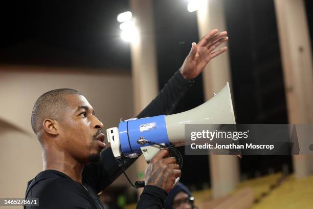 Presnel Kimpembe of PSG addresses the fans using a megaphone following the 3-1 defeat in the Ligue 1 match between AS Monaco and Paris Saint-Germain...