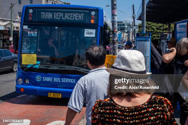 People wait to board 'train replacement' bus in Newtown on February 12, 2023 in Sydney, Australia. On July 6, 2022 the Australian government lifted...