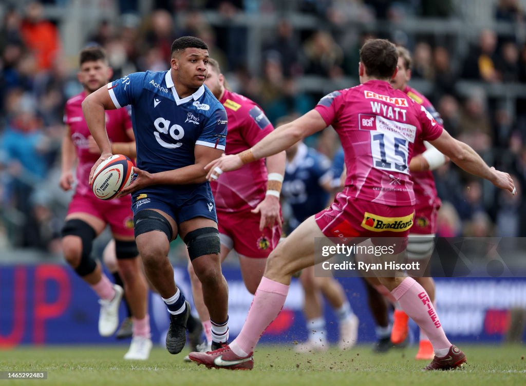 Rus Rugby Exeter Tristan Woodman of Sale Sharks is challenged by Tom Wyatt of Exeter ...