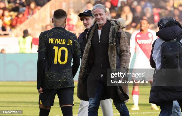 Emmanuel Petit, Neymar Jr of PSG before the Ligue 1 match between AS Monaco and Paris Saint-Germain at Stade Louis II on February 11, 2023 in Monaco,...