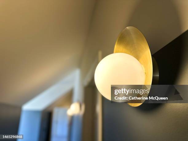 modern sconce against two-tone painted wall background - sconce stock pictures, royalty-free photos & images