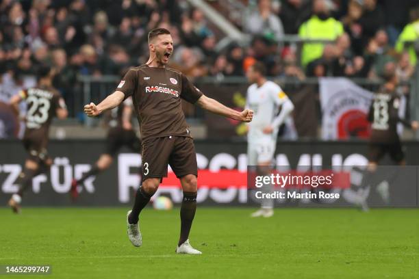 Karol Mets of FC St. Pauli celebrates after teammate Connor Metcalfe scoring the team's first goal during the Second Bundesliga match between FC St....