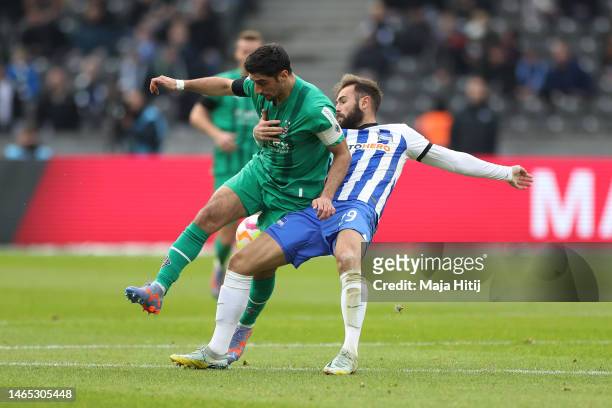Lars Stindl of Borussia Monchengladbach battles for possession with Lucas Tousart of Hertha BSC during the Bundesliga match between Hertha BSC and...