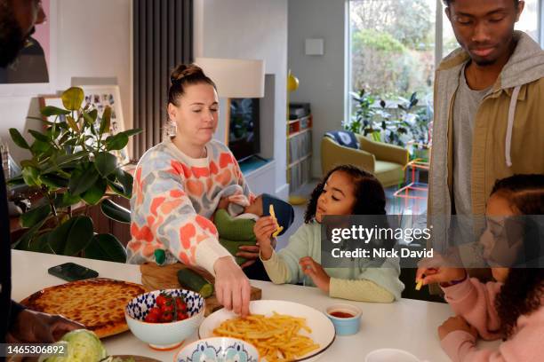 family mealtime at home with the children - generational family stock pictures, royalty-free photos & images