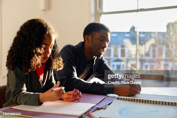 young girl drawing a picture at home - school life balance stock pictures, royalty-free photos & images