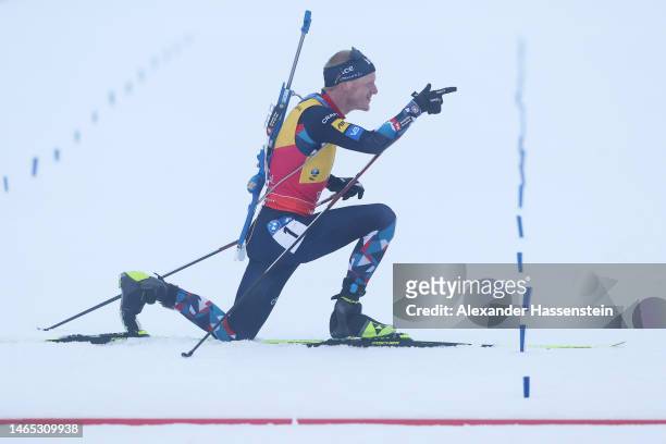 Johannes Thingnes Boe of Norway celebrates as he approaches the finish line in first place during the Men 12.5 km Pursuit at the IBU World...