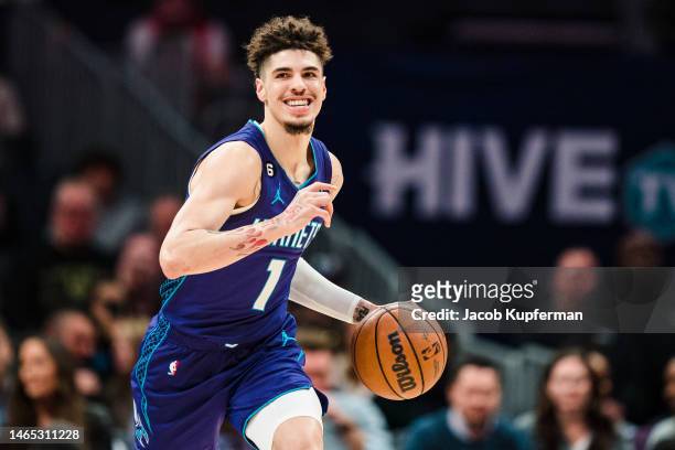LaMelo Ball of the Charlotte Hornets brings the ball up court against the Denver Nuggets during their game at Spectrum Center on February 11, 2023 in...