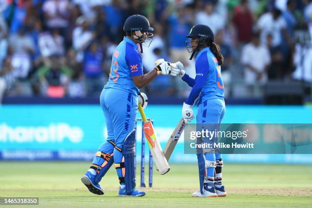 Richa Ghosh and Jemimah Rodrigues of India interact during the ICC Women's T20 World Cup group B match between India and Pakistan at Newlands Stadium...