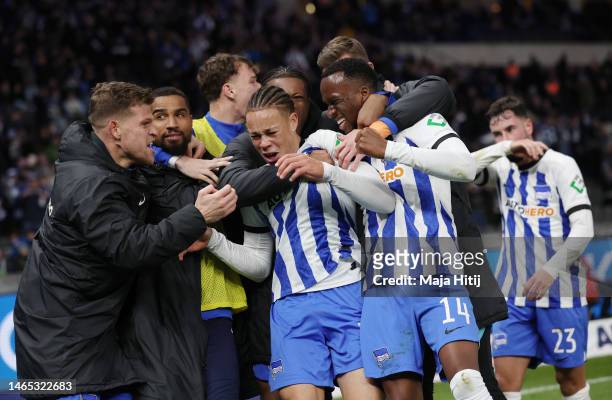 Dodi Lukebakio of Hertha BSC celebrates with teammates after scoring the team's third goal during the Bundesliga match between Hertha BSC and...