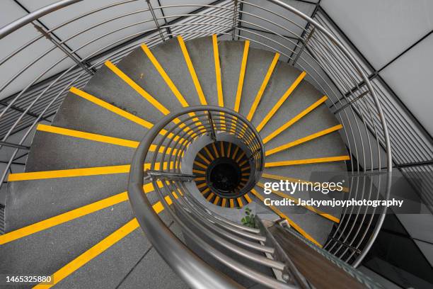 directly above shot of  a spiral staircase - pivot stock pictures, royalty-free photos & images