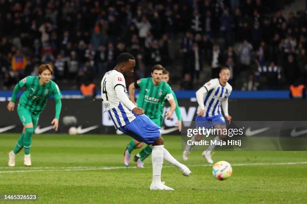 Dodi Lukebakio of Hertha BSC scores the team's fourth goal from a penalty kick during the Bundesliga match between Hertha BSC and Borussia...