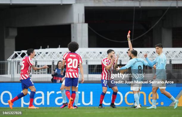 Stefan Savic of Atletico Madrid is shown a red card by Referee Jorge Figueroa Vazquez during the LaLiga Santander match between RC Celta and Atletico...