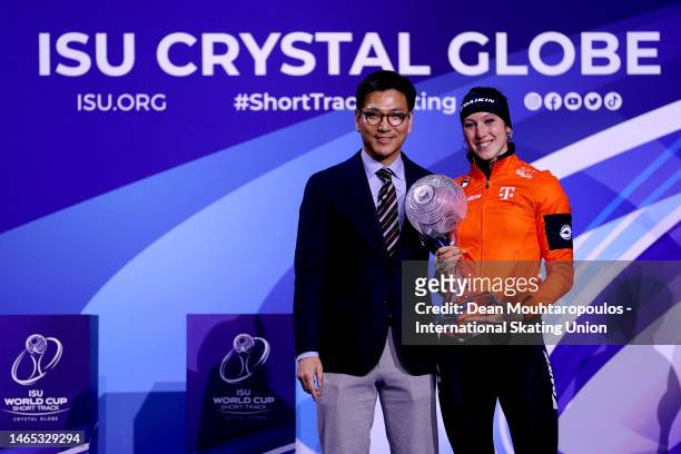 Jae Youl Kim, President of the ISU presents Suzanne Schulting of Netherlands the ISU Crystal Globe Trophy after the ISU World Cup Short Track at...
