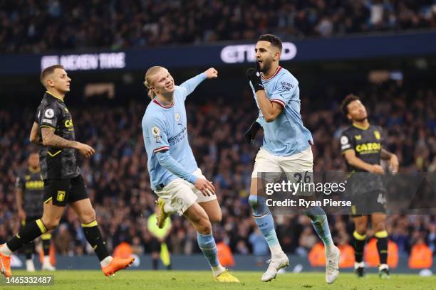 Riyad Mahrez of Manchester City celebrates after scoring their sides third goal from the penalty spot during the Premier League match between...