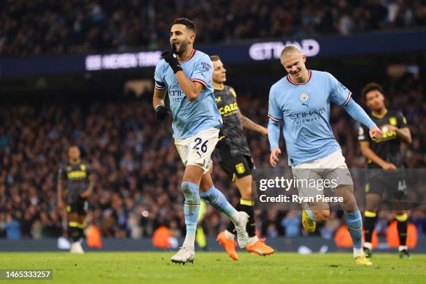 Riyad Mahrez of Manchester City celebrates after scoring their sides third goal from the penalty spot during the Premier League match between...