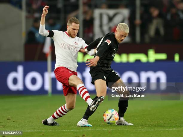 Philipp Max of Eintracht Frankfurt is challenged by Benno Schmitz of 1.FC Koln during the Bundesliga match between 1. FC Koeln and Eintracht...