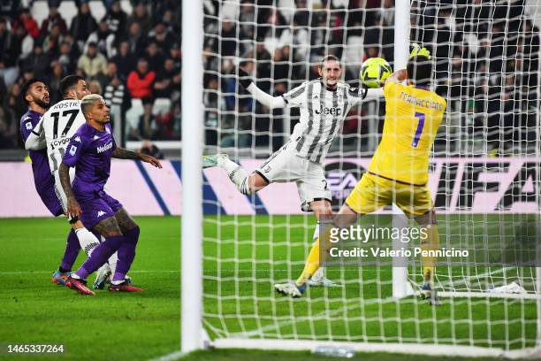 Adrien Rabiot of Juventus scores the team's first goal past Pietro Terracciano of ACF Fiorentina during the Serie A match between Juventus and ACF...