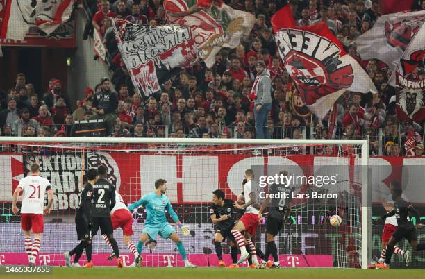 Kevin Trapp of Eintracht Frankfurt fails to stop a goal scored by Timo Hubers of 1.FC Koln, his team's first goal during the Bundesliga match between...