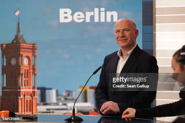 Kai Wegner, lead candidate of the German Christian Democrats in Berlin state elections, prepares for a television interview following initial...