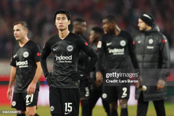 Daichi Kamada of Eintracht Frankfurt looks dejected following the team's defeat in the Bundesliga match between 1. FC Koeln and Eintracht Frankfurt...