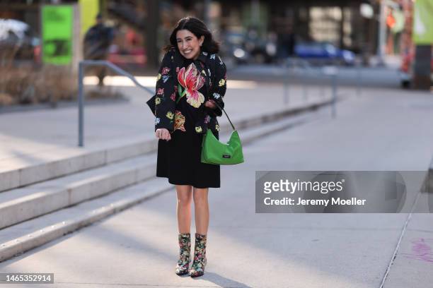 April Lockhart seen wearing Kate Spade flower earrings, black midi dress with a flower print, Kate Spade black short jacket with multicolor flower...