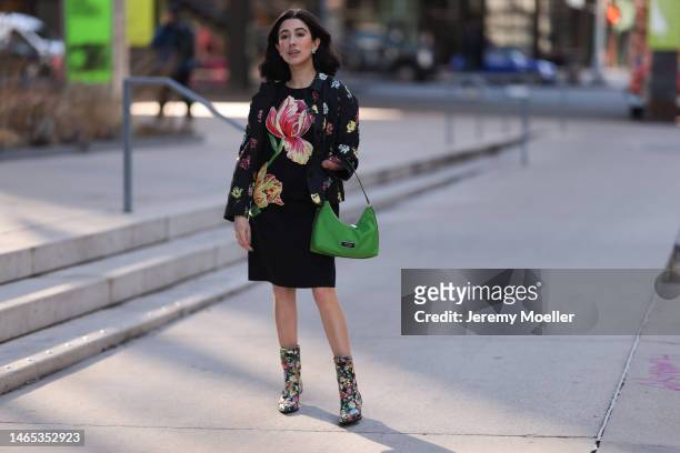 April Lockhart seen wearing Kate Spade flower earrings, black midi dress with a flower print, Kate Spade black short jacket with multicolor flower...