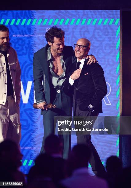 Harry Styles and Stanley Tucci on stage during The BRIT Awards 2023 at The O2 Arena on February 11, 2023 in London, England.