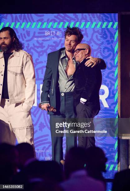 Harry Styles and Stanley Tucci on stage during The BRIT Awards 2023 at The O2 Arena on February 11, 2023 in London, England.