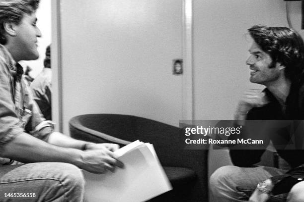 Television host Jay Leno meets with actor Harry Hamlin backstage in Studio Three before "The Tonight Show with Jay Leno" in February 1995 in Burbank,...