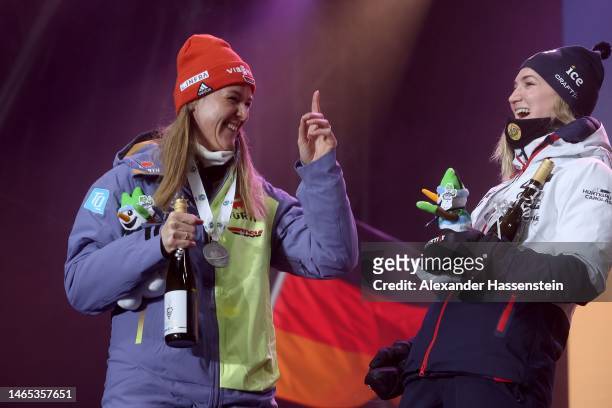 Denise Herrmann-Wick of Germany celebrates winning the Silver Medal with Marte Olsbu Roiseland of Norway who wins the Bronze Medal during the Medal...