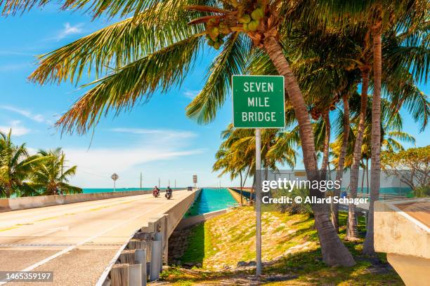 entrance sign to seven mile bridge florida keys usa - overseas highway stock pictures, royalty-free photos & images