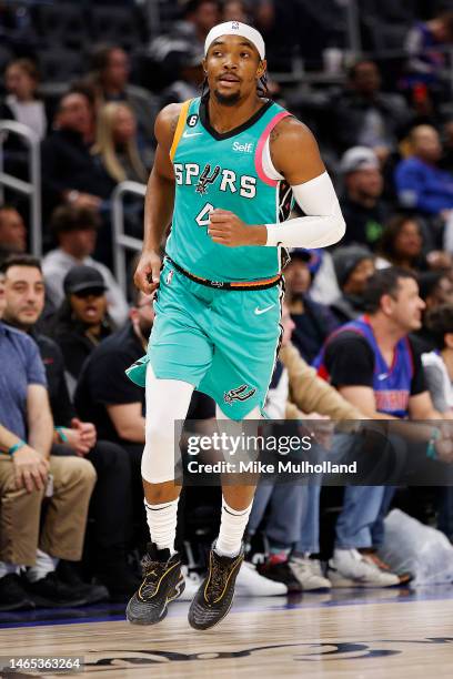 Devonte' Graham of the San Antonio Spurs runs up the court in the second half of a game against the Detroit Pistons at Little Caesars Arena on...